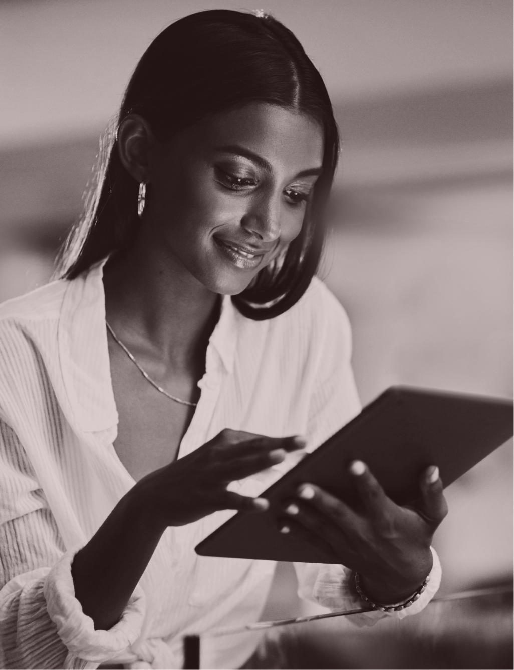 Person reviewing immigration information on a tablet.